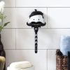 Rukoväť holiaceho strojčeka, prísavný nástavec, hygienický úložný priestor, odnímateľný
